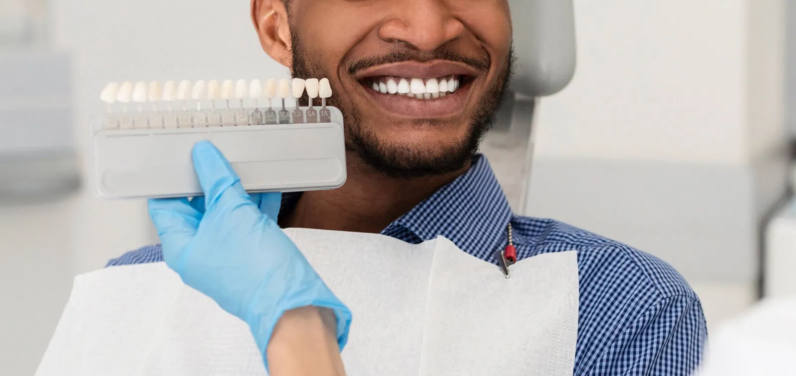 Dentist showing a patient her digital smile design on screen